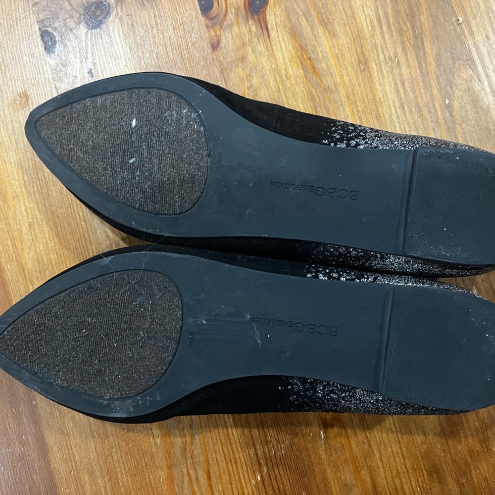Still has some room for love. Size 6B/36. Black suede feel with silver glitters.
